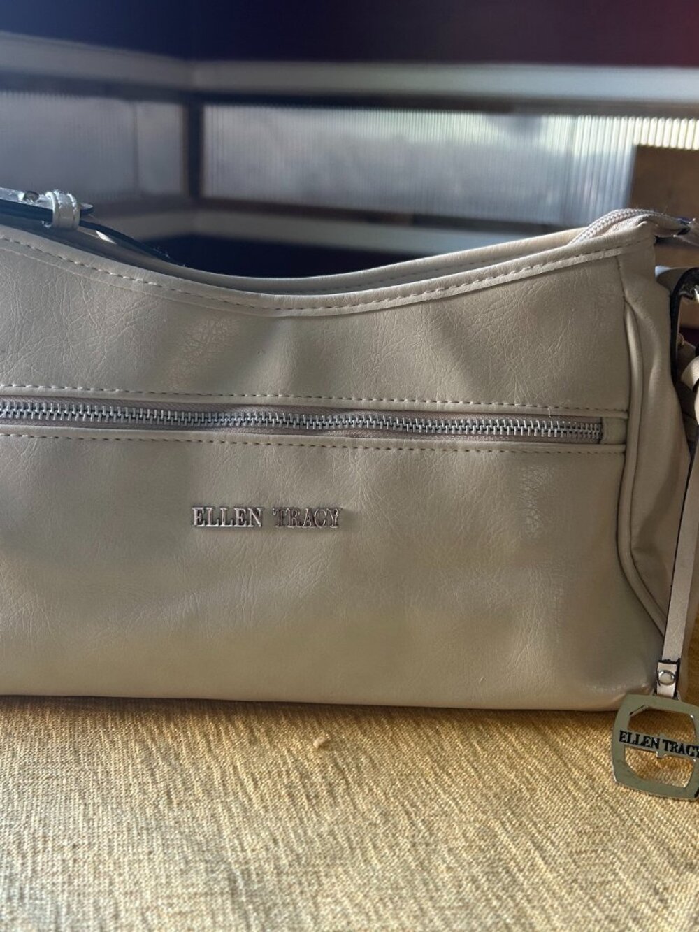 Ellen Tracy ivory  shoulder bag  with sliver toned logo plate & zip front pocket